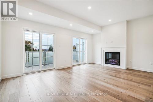 2 - 29 Cyclone Way, Fort Erie (337 - Crystal Beach), ON - Indoor Photo Showing Living Room With Fireplace