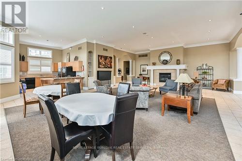 210 - 2055 Appleby Line, Burlington, ON - Indoor Photo Showing Living Room With Fireplace