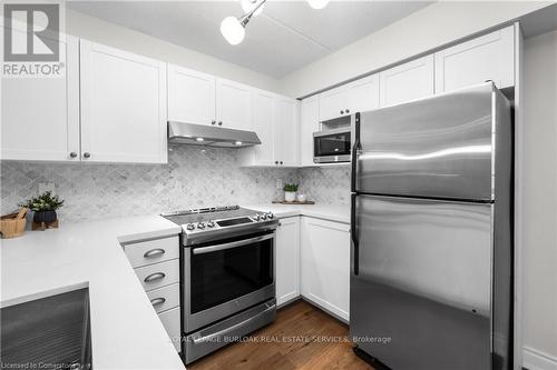 210 - 2055 Appleby Line, Burlington, ON - Indoor Photo Showing Kitchen With Upgraded Kitchen