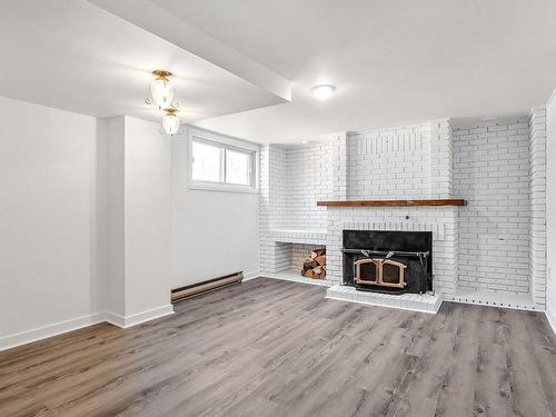 Family room - 1432 Rue W.-Joubert, Terrebonne (Terrebonne), QC - Indoor Photo Showing Living Room With Fireplace