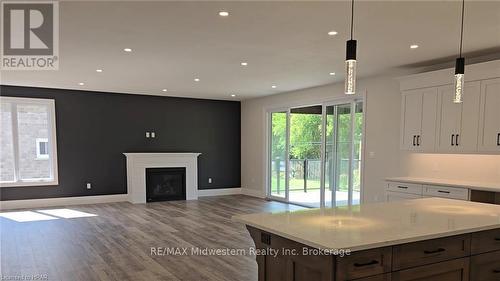 475 Keeso Lane, North Perth (Listowel), ON - Indoor Photo Showing Living Room With Fireplace