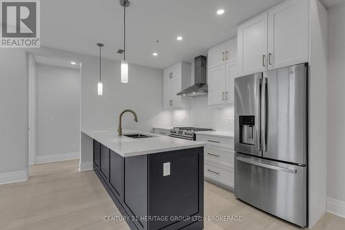 607 - 129 South Street N, Gananoque, ON - Indoor Photo Showing Kitchen With Double Sink With Upgraded Kitchen