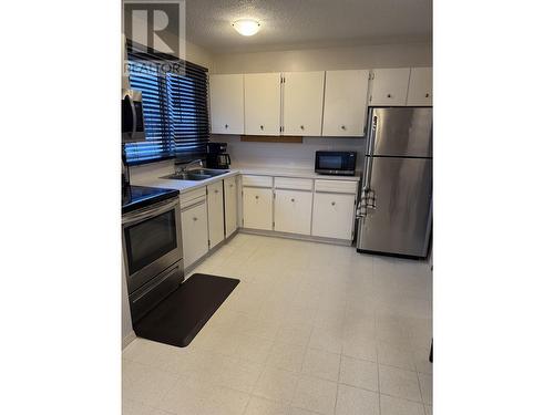 407 Centennial Drive, Mackenzie, BC - Indoor Photo Showing Kitchen With Double Sink