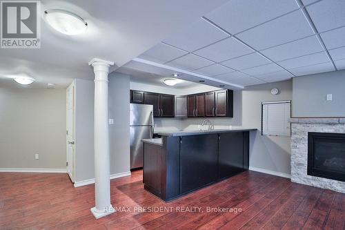 34 Harry Gay Drive, Clarington, ON - Indoor Photo Showing Kitchen With Fireplace