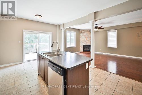 34 Harry Gay Drive, Clarington, ON - Indoor Photo Showing Kitchen With Fireplace With Double Sink