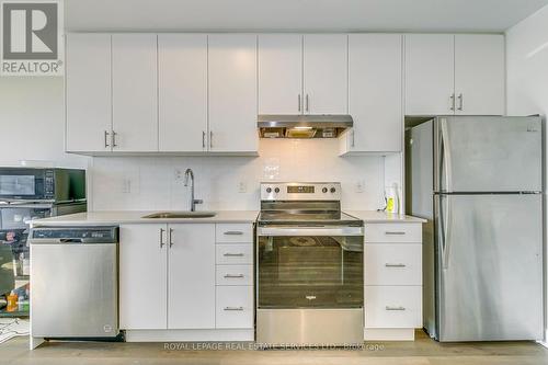 906 - 3200 William Coltson Avenue, Oakville, ON - Indoor Photo Showing Kitchen With Stainless Steel Kitchen