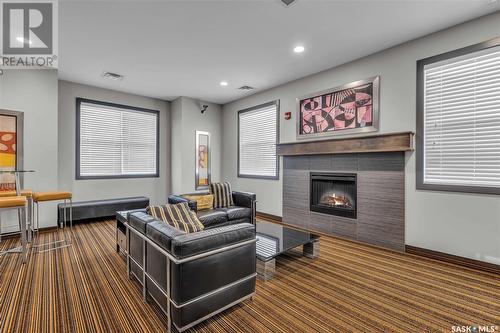 C105 415 Hunter Road, Saskatoon, SK - Indoor Photo Showing Living Room With Fireplace