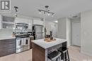 C105 415 Hunter Road, Saskatoon, SK  - Indoor Photo Showing Kitchen With Stainless Steel Kitchen With Upgraded Kitchen 