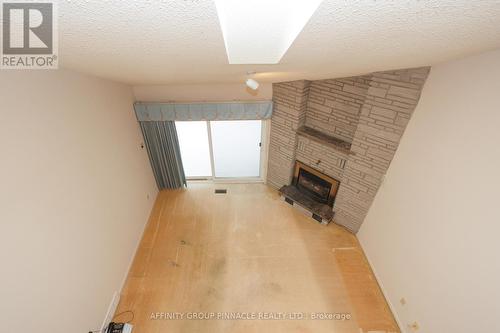 15 - 5 Heritage Way, Kawartha Lakes (Lindsay), ON - Indoor Photo Showing Other Room With Fireplace