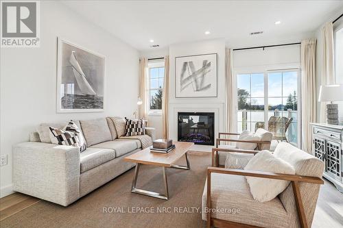 3 - 29 Cyclone Way, Fort Erie (337 - Crystal Beach), ON - Indoor Photo Showing Living Room With Fireplace