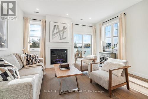 3 - 29 Cyclone Way, Fort Erie (337 - Crystal Beach), ON - Indoor Photo Showing Living Room With Fireplace