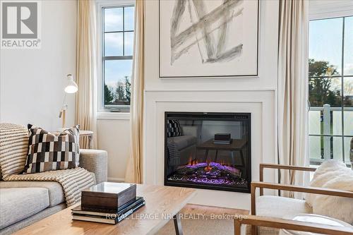 3 - 29 Cyclone Way, Fort Erie (337 - Crystal Beach), ON - Indoor Photo Showing Living Room With Fireplace