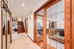 Entrance hallway, closet on the left side and living room and formal dining room on the right - 