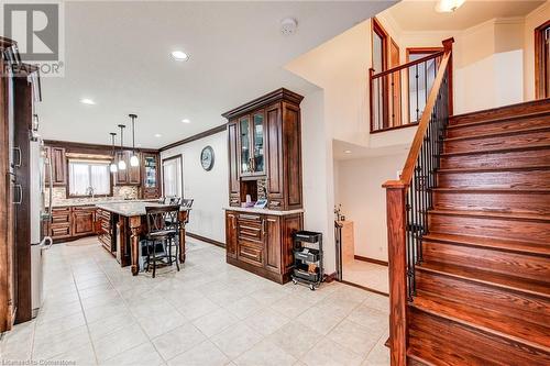 Kitchen on the left with door to garage and side yard, stairs leading to upper level - 48 Wayne Avenue, Cambridge, ON - Indoor Photo Showing Other Room