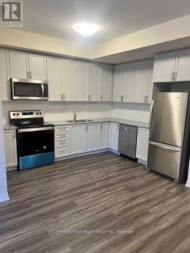 122 - 1593 Rose Way, Milton, ON - Indoor Photo Showing Kitchen With Stainless Steel Kitchen