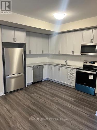 121 - 1593 Rose Way, Milton, ON - Indoor Photo Showing Kitchen With Stainless Steel Kitchen With Double Sink