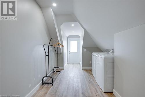 Laundry area with washer and dryer and light wood-type flooring - 102 Wellington Street N Unit# 4, Hamilton, ON - Indoor Photo Showing Laundry Room