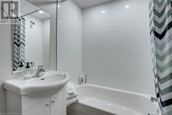 Bathroom with shower / bath combo and vanity - 