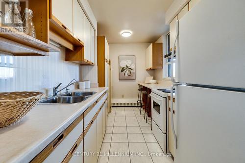 719 - 1625 Bloor Street E, Mississauga, ON - Indoor Photo Showing Kitchen With Double Sink