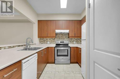 219 - 760 Woodhill Drive, Centre Wellington (Fergus), ON - Indoor Photo Showing Kitchen With Double Sink