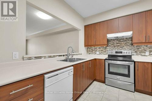 219 - 760 Woodhill Drive, Centre Wellington (Fergus), ON - Indoor Photo Showing Kitchen With Double Sink