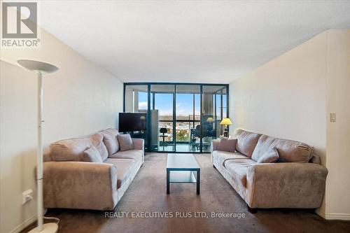 702 - 4235 Sherwoodtowne Boulevard, Mississauga, ON - Indoor Photo Showing Living Room