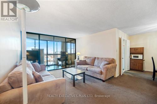 702 - 4235 Sherwoodtowne Boulevard, Mississauga, ON - Indoor Photo Showing Living Room