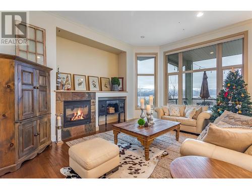 Lake Views from your main living areas - 558 Gowen Place, Kelowna, BC - Indoor Photo Showing Living Room With Fireplace