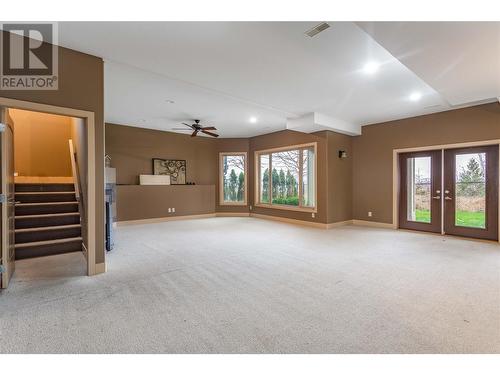 Lower Level Family/Rec/Flex Room walkout to back fenced yard. - 558 Gowen Place, Kelowna, BC - Indoor Photo Showing Other Room