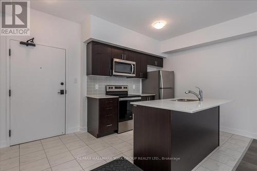 105 - 4 Spice Way, Barrie, ON - Indoor Photo Showing Kitchen With Stainless Steel Kitchen