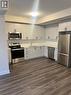 120 - 1593 Rose Way, Milton, ON  - Indoor Photo Showing Kitchen With Stainless Steel Kitchen With Double Sink 