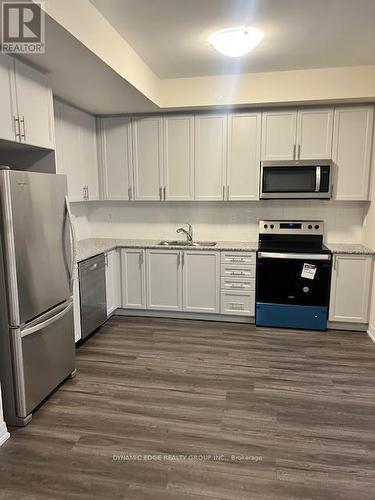 123 - 1593 Rose Way, Milton, ON - Indoor Photo Showing Kitchen With Stainless Steel Kitchen With Double Sink