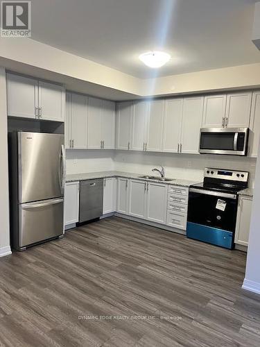 123 - 1593 Rose Way, Milton, ON - Indoor Photo Showing Kitchen With Stainless Steel Kitchen With Double Sink With Upgraded Kitchen