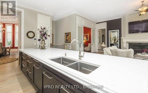 45 - 11 Lambeth Lane, Puslinch, ON - Indoor Photo Showing Kitchen With Fireplace With Double Sink