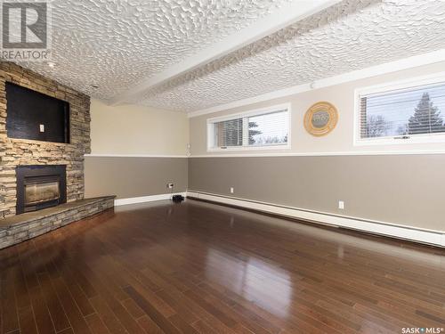 122 Hawkes Bay, Regina, SK - Indoor Photo Showing Other Room With Fireplace