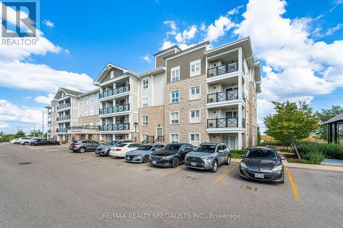 411 - 1005 Nadalin Heights, Milton, ON - Outdoor With Balcony With Facade