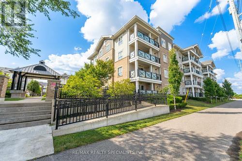 411 - 1005 Nadalin Heights, Milton, ON - Outdoor With Balcony With Facade