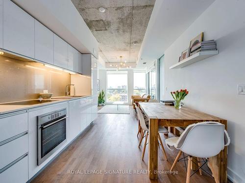 1017-20 Minowan Miikan Lane, Toronto, ON - Indoor Photo Showing Dining Room With Fireplace