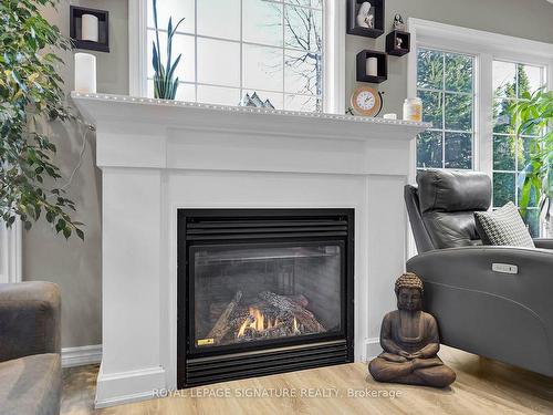 99 Westwinds Dr, London, ON - Indoor Photo Showing Living Room With Fireplace