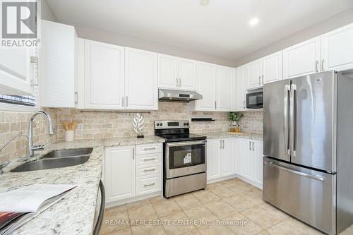 1016 Mccuaig Drive, Milton, ON - Indoor Photo Showing Kitchen With Stainless Steel Kitchen With Double Sink