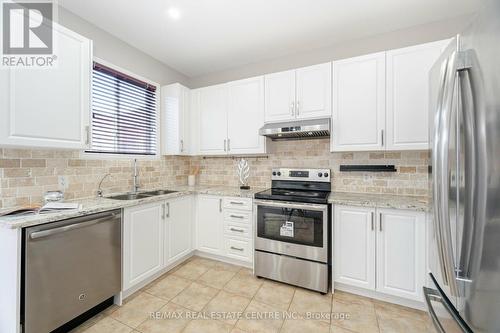 1016 Mccuaig Drive, Milton, ON - Indoor Photo Showing Kitchen With Stainless Steel Kitchen With Double Sink With Upgraded Kitchen