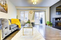 Living room with dark wood-type flooring - 