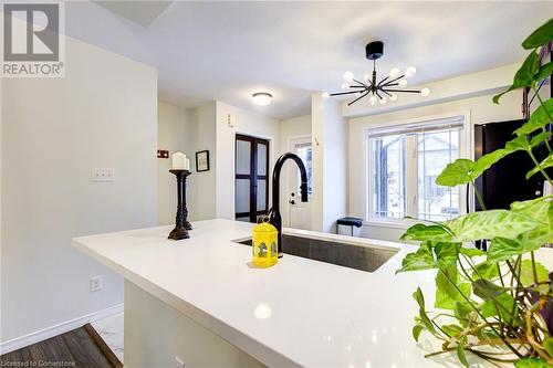 Kitchen featuring sink, a notable chandelier, and hardwood / wood-style flooring - 350 Dundas Street S Unit# 30, Cambridge, ON - Indoor