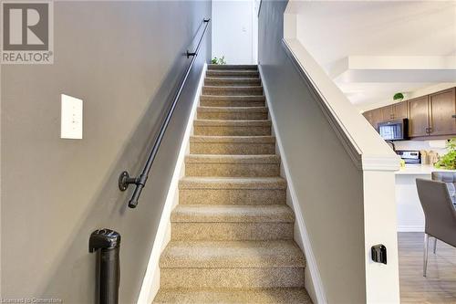 Stairs featuring wood-type flooring - 350 Dundas Street S Unit# 30, Cambridge, ON - Indoor Photo Showing Other Room