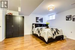 Bedroom with light hardwood / wood-style floors - 