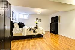 Bedroom with light wood-type flooring - 