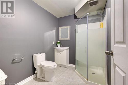 Bathroom featuring tile patterned flooring, vanity, toilet, and walk in shower - 350 Dundas Street S Unit# 30, Cambridge, ON - Indoor Photo Showing Bathroom