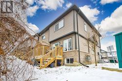 Snow covered house with central air condition unit - 