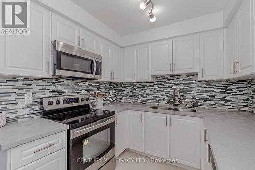 14 - 460 Bristol Road W, Mississauga, ON - Indoor Photo Showing Kitchen With Stainless Steel Kitchen With Double Sink With Upgraded Kitchen