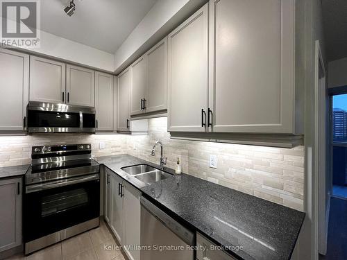 601 - 60 Absolute Avenue, Mississauga (City Centre), ON - Indoor Photo Showing Kitchen With Double Sink